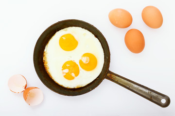 Fried eggs in frying pan. Breakfast. Healthy food.