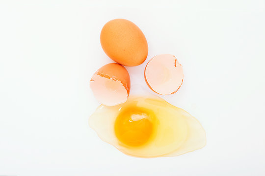 Broken egg on white background