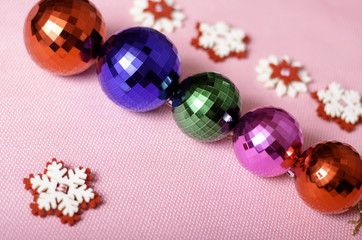 Multi-colored Christmas balls and snowflakes.