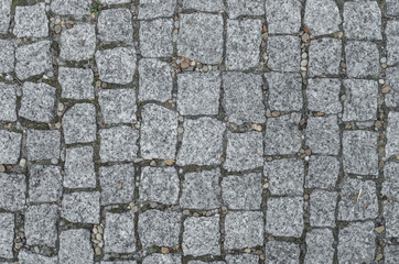 Old road paved with granite stones