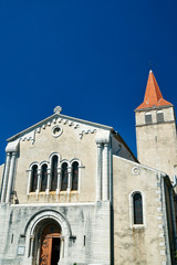 The facade of a medieval church in Villeneuve-de-Berg, France