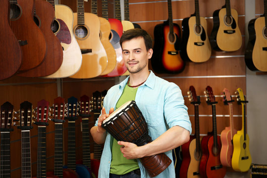 Handsome young man in music store