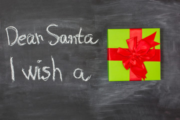 Fototapeta na wymiar Dear Santa is written on a blackboard and christmas decoration