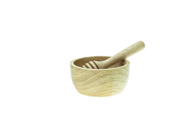 Wooden honey drizzler and bowl isolated on white background