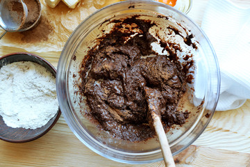 Preparing dough for chocolate pie on table close up