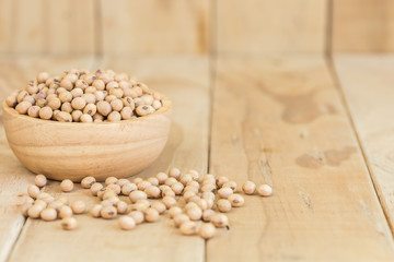 Soy beans in bowl on wooden desk