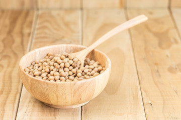 Soy beans in bowl on wooden desk