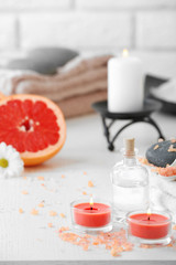 Composition of spa treatment on table, on white background