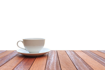 White coffee cup on wood table isolated on white background