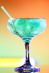 Glass of cocktail on bright background