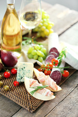 Still life with various types of Italian food and wine