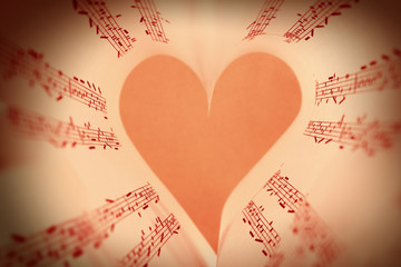 Book pages curved into heart shape close up