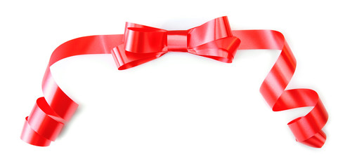 Red bow with curved ribbon isolated on white background