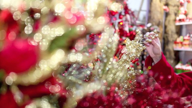 woman shopping christmas decorations in market store