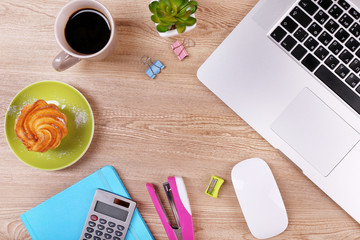 Top view of comfortable working place on wooden background