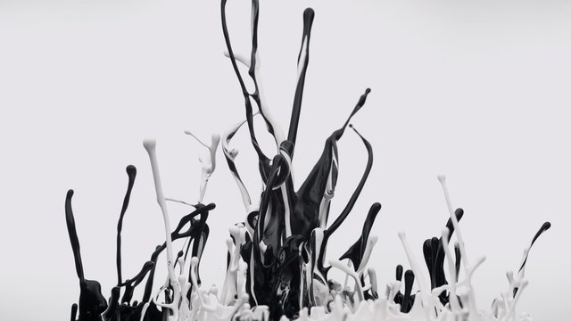 Black and white paint bouncing and making splash. Shot with high speed camera, phantom flex 4K.  Slow Motion. 