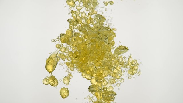 Pouring oil into water. Shot with high speed camera, phantom flex 4K. Slow Motion. 