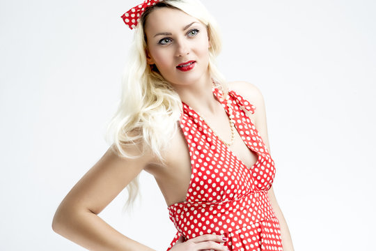Pinup Style and Concepts. Sensual and Smiling Caucasian Blond Woman