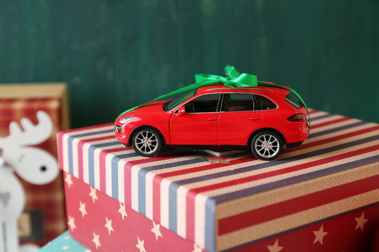 Christmas gifts on color wooden background