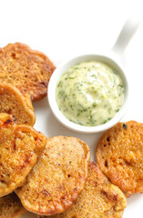Indian cuisine - Crispy cauliflower pakora with creame cheese dip on white background