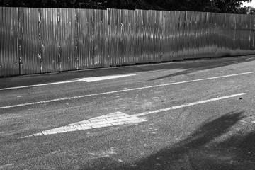 white arrow,white arrow on the black road