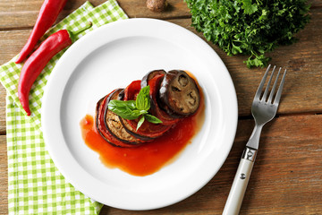 Ratatouille on plate, on table background