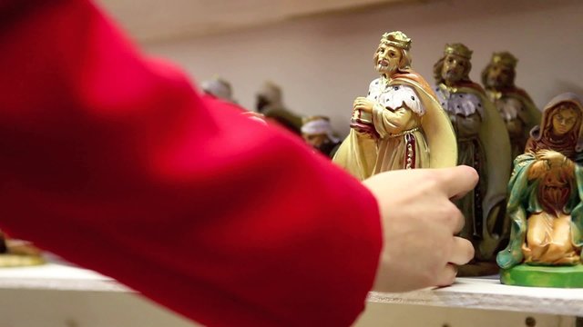 christmas woman shopping in market store, magi statuette