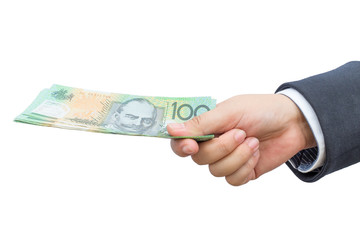 Businessman hand holding Australian dollars (AUD) on isolated background.