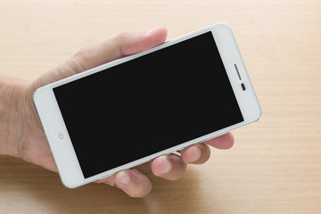 of man hand holding smart phone