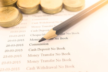 Bank statement paper with coin and pencil on vintage tone : Commission concept.