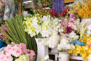 Colourful artificial flower made from plastic and fabric.