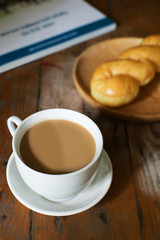 hot coffee with sugar bread and newspaper