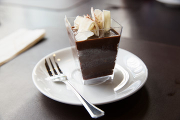 Chocolate cake in square glass