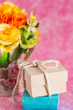 Gift boxes on a pink background.