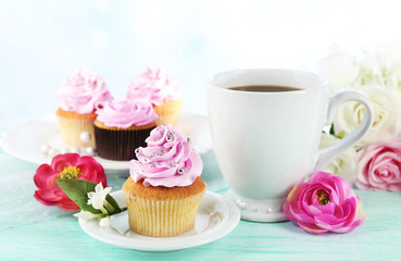Tasty cupcakes on tray, on light background