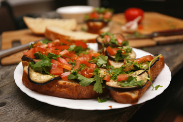 Bruschetta with grilled eggplant and vegetables on ciabatta