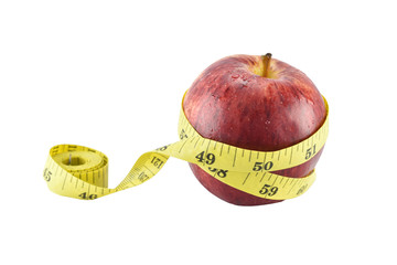 Red apple and yellow measuring tape concept for healthy diet and body weight control.