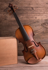 Fototapeta na wymiar Vintage violin on wooden background