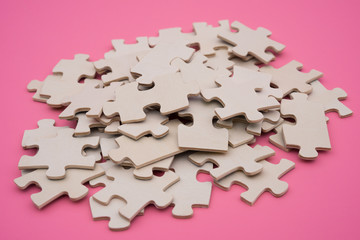 jigsaw puzzle on a pink background