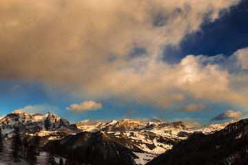 wind and cold on a road in a winter evening in the italian dolom