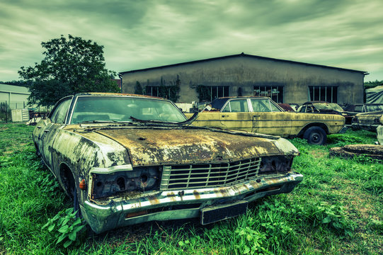 Wrecked american cars at an oldtimer scrapyard