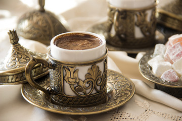 Turkish coffee with delight and traditional copper serving set