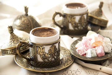 Turkish coffee with delight and traditional copper serving set