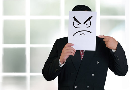 Businessman Wearing Angry Face Mask