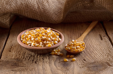corn in a wooden spoon