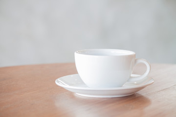 White coffee cup on wooden table with clipping path