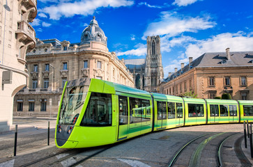 Modern tram on the streets of the old town of Reims, France