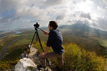 Photographer on top of the mountain. Taken with a fisheye lens
