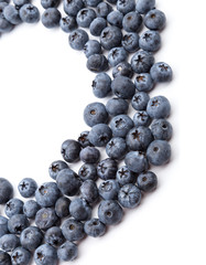 heap of blueberries on white background