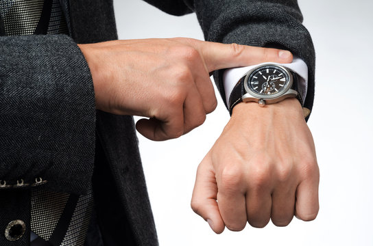 businessman watching time at their wristwatches